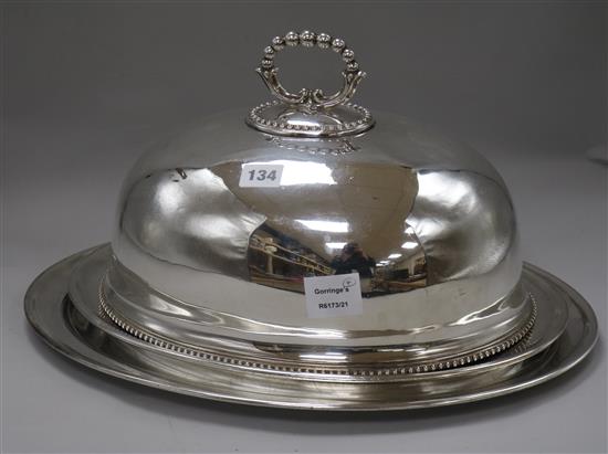 Two oval silver plated meat dishes and a meat dish cover